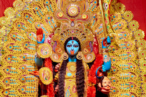 Idol of hindu goddess kali (Kali is one of the ten Mahavidyas, a list which combines Sakta and Buddhist goddesses) in a community pandal (fabricated structure, mostly temporary). Photo taken during Diwali festival in Kolkata, West Bengal. Kali is worshipped as a deity, considered a strong mother-figure and symbolic of motherly-love. dusshera